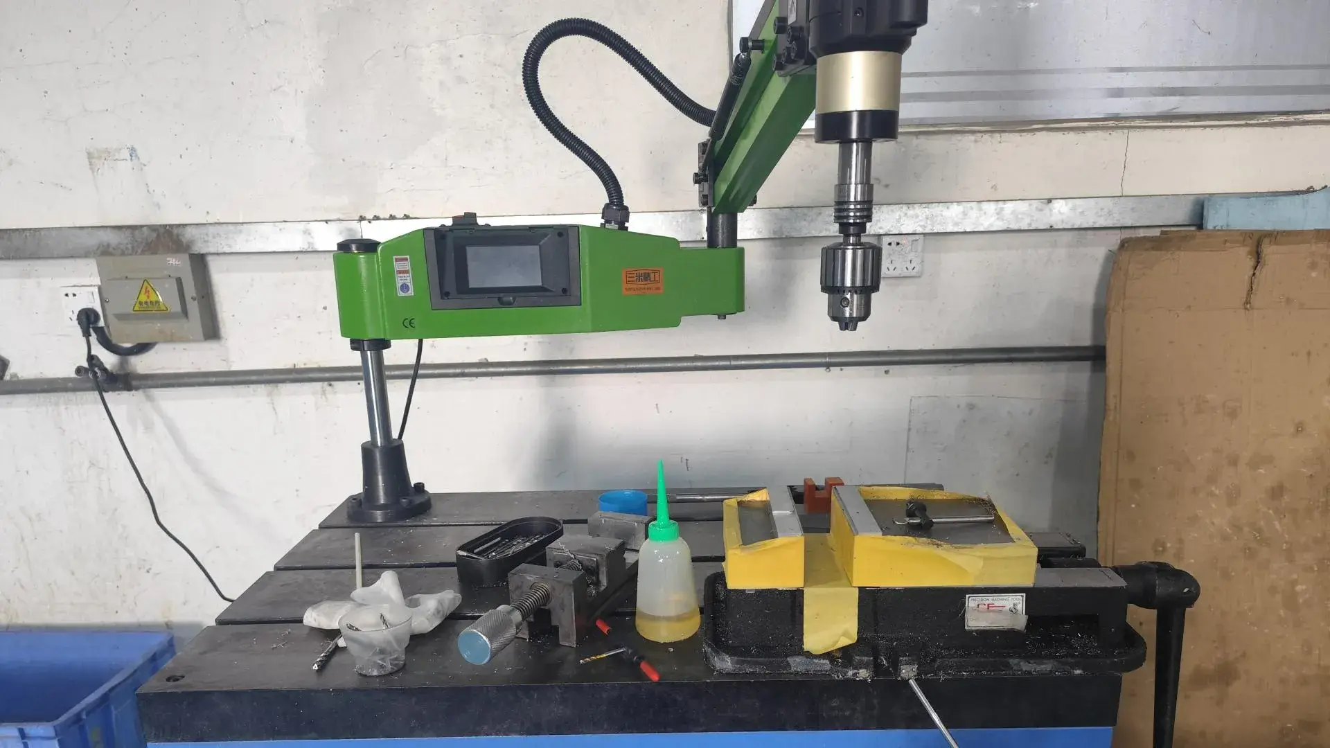 Dedicated drilling and tapping machine demonstrating our capability to handle complex threading requirements for industrial parts.