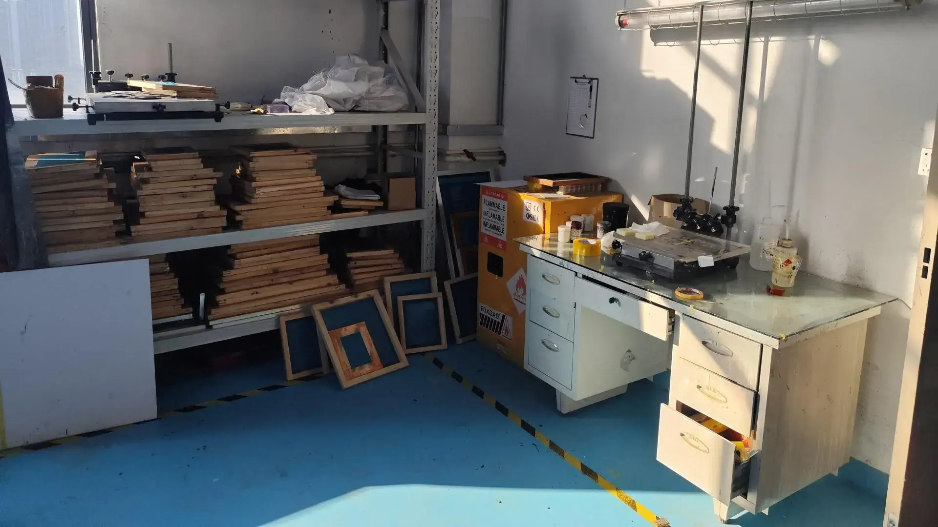 Our silk-screen printing area where technicians apply high-precision logos, functional markings, and labels to finished components