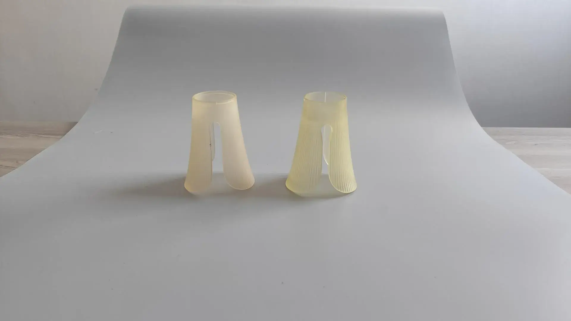 A custom-dyed polycarbonate lampshade prototype, CNC machined and hand-polished to a semi-transparent finish for optimal light diffusion and aesthetic appeal.